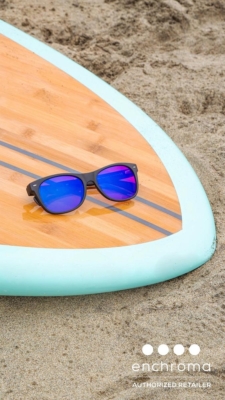 ECP Ellis Summer sunglasses resting on surfboard