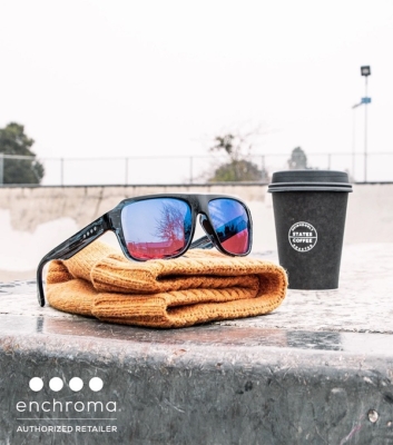 ECP Northside Bluestream sunglasses resting on beanie next to coffee cup